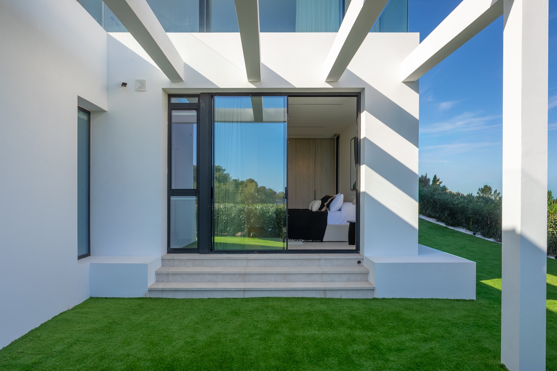 Resa Estates for sale Ibiza Vlla Aixa te koop sale lift sea views exyterior grass.jpg